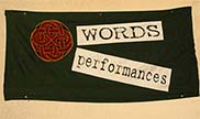 A flag with 'WORDS' and 'performances on it